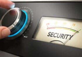 Hand turning a knob up to the maximum, Concept image for illustration of security improvement.